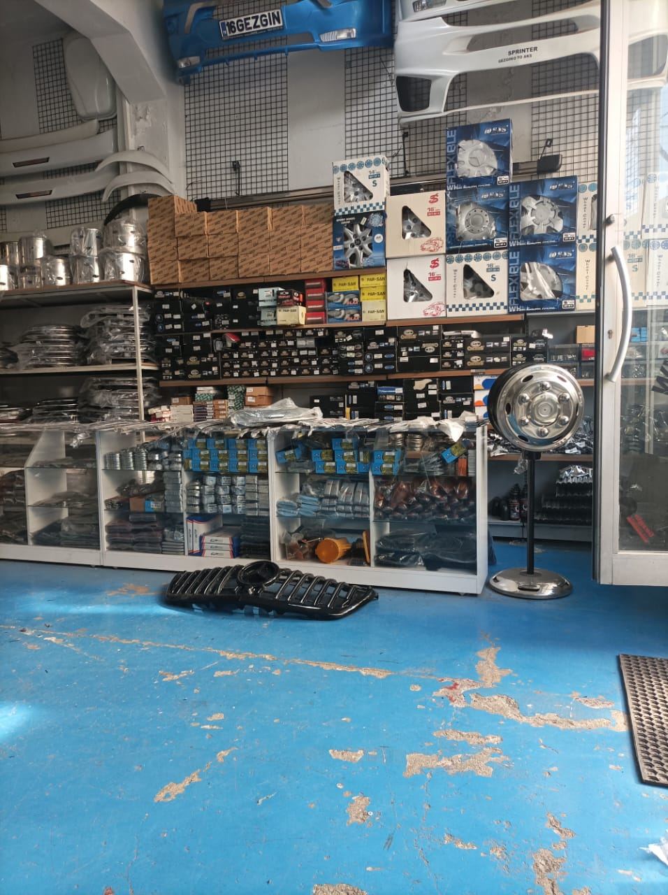 MV Auto Parts warehouse shelves stocked with Sprinter bumpers, grilles and wheel covers